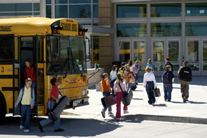 photo of student musicians getting off bus